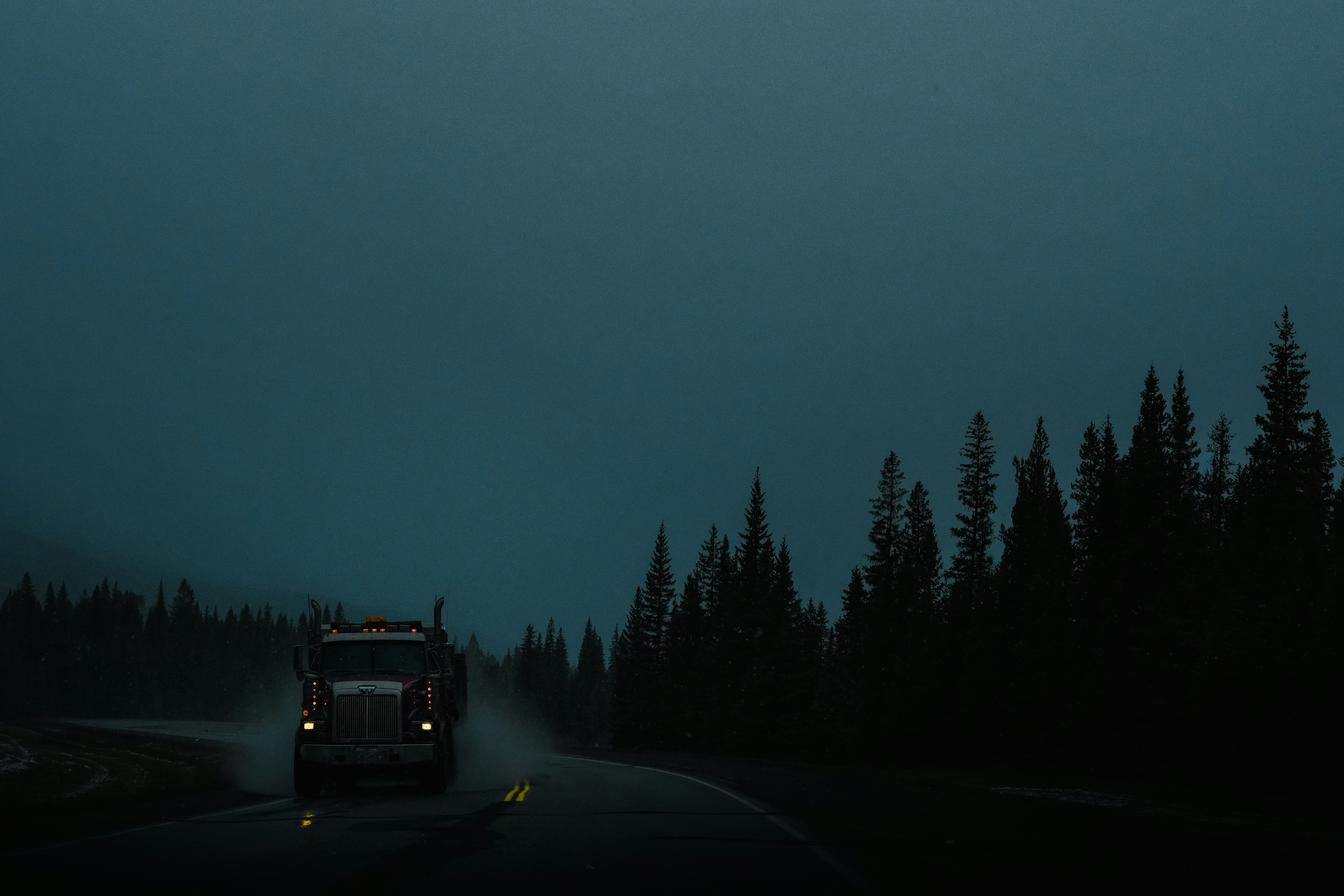 red car on road during night time